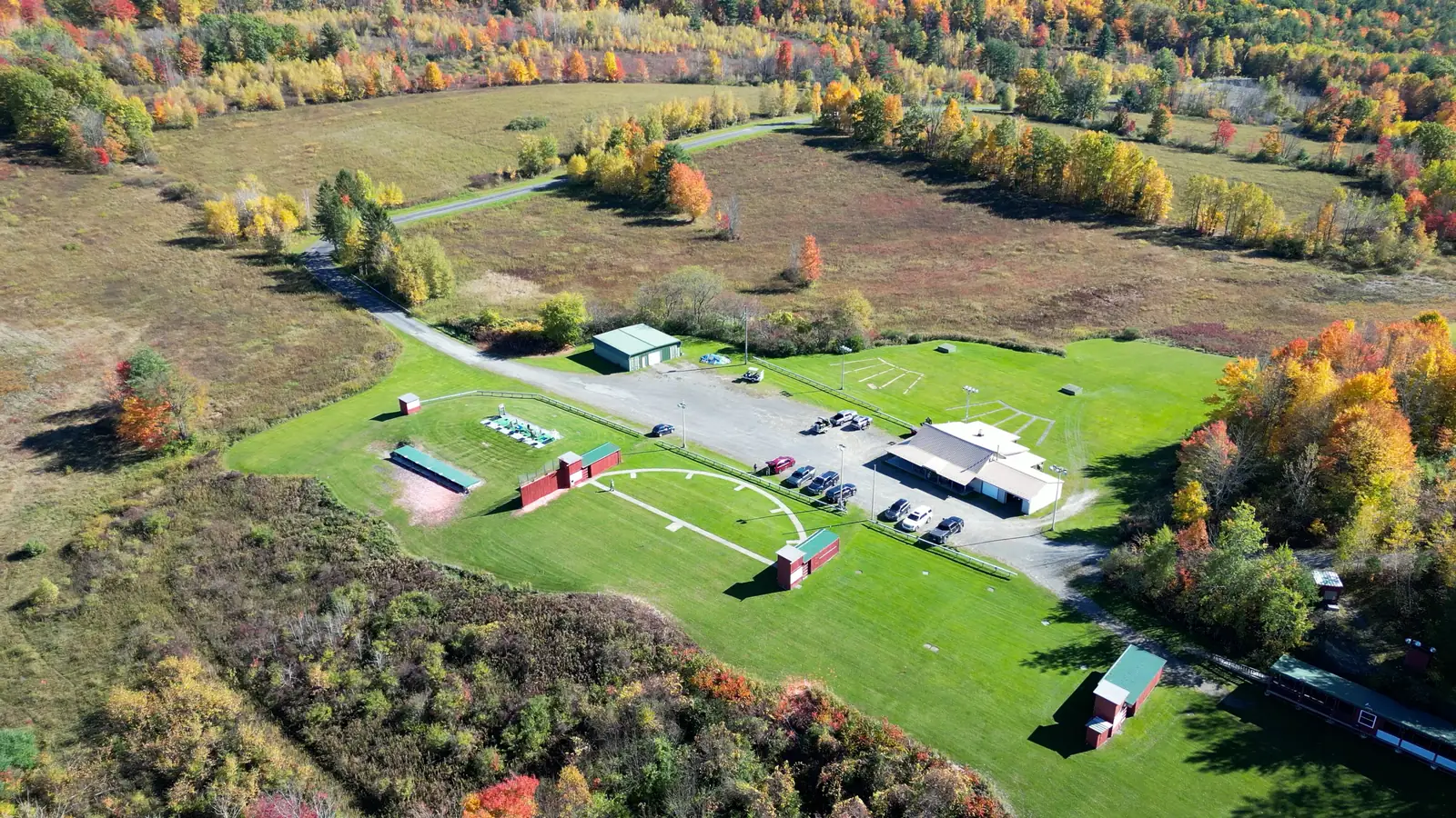 Aerial view of the Binghamton Gun Club grounds and shooting fields surrounded by fall foliage