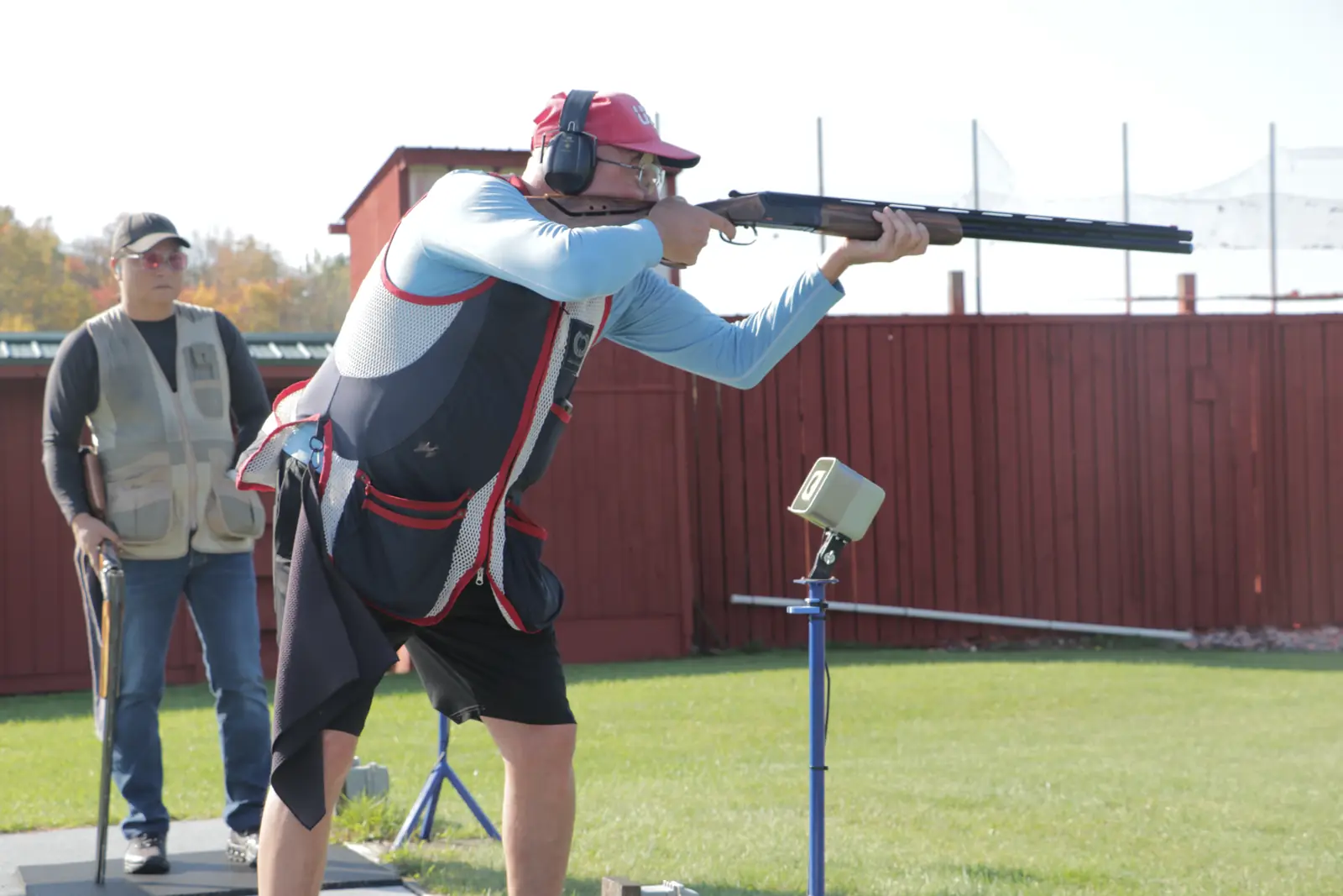 Shooter calling for a target with a referee behind