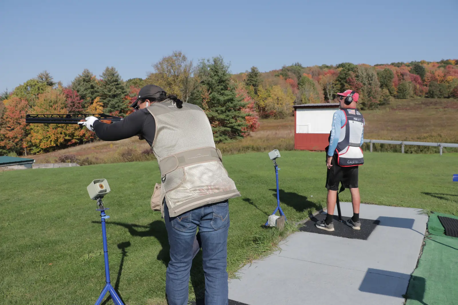 Two shooters taking their turns on the bunker shooting line